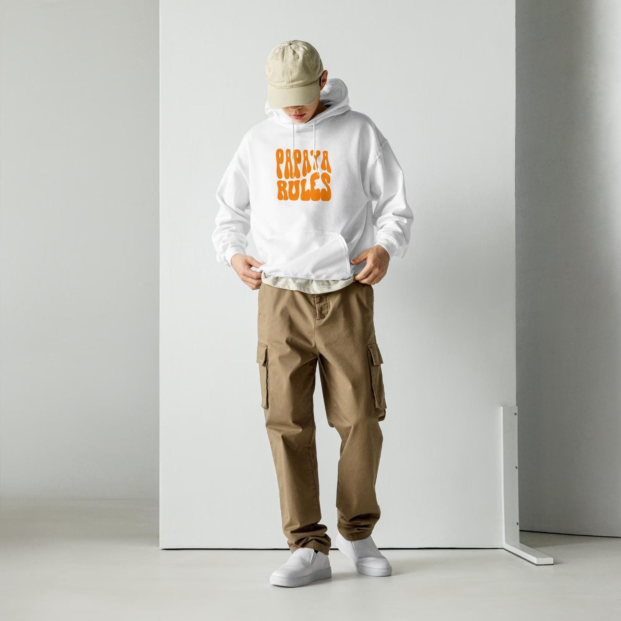 A white heavy blend hoodie with the text Papaya Rules in orange on the front in the center.