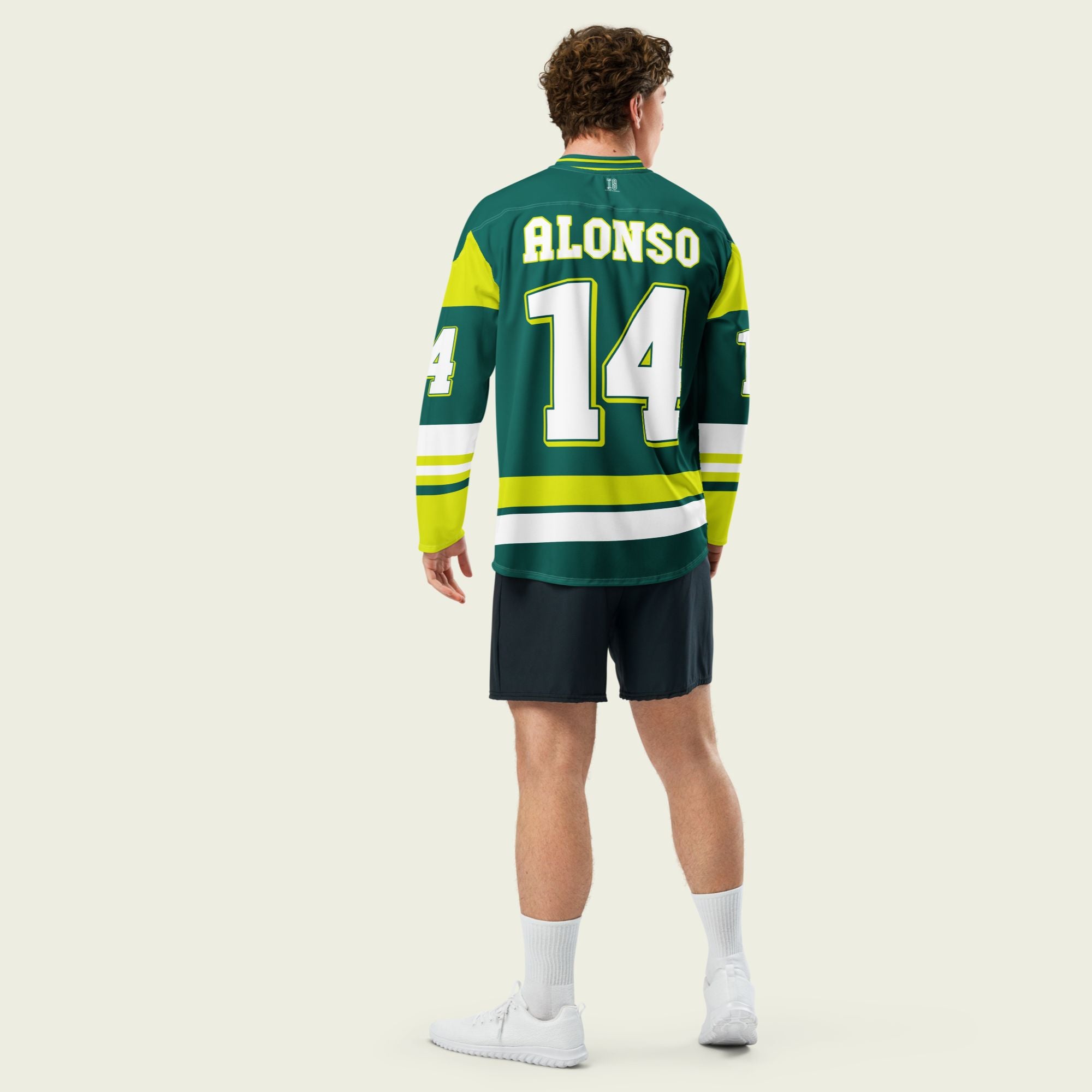A British Green hockey jersey with Fernando Alonso's Aston Martin F1 racing number 14 in white on the front and back. It has the name Alonso on the back and front in white as well.