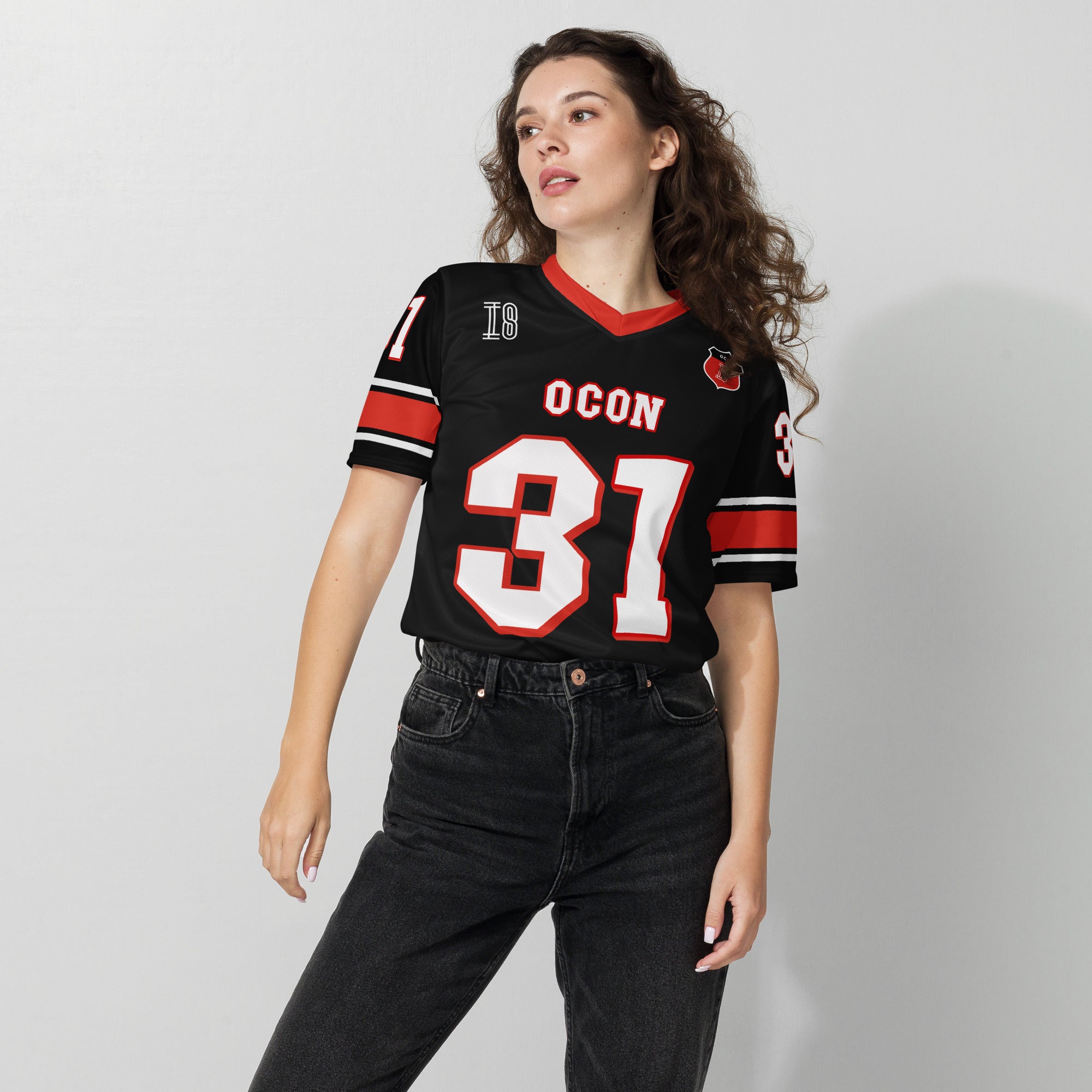 A black and red football jersey with Ocon's Haas F1 Racing number 31 in white on the front and back.