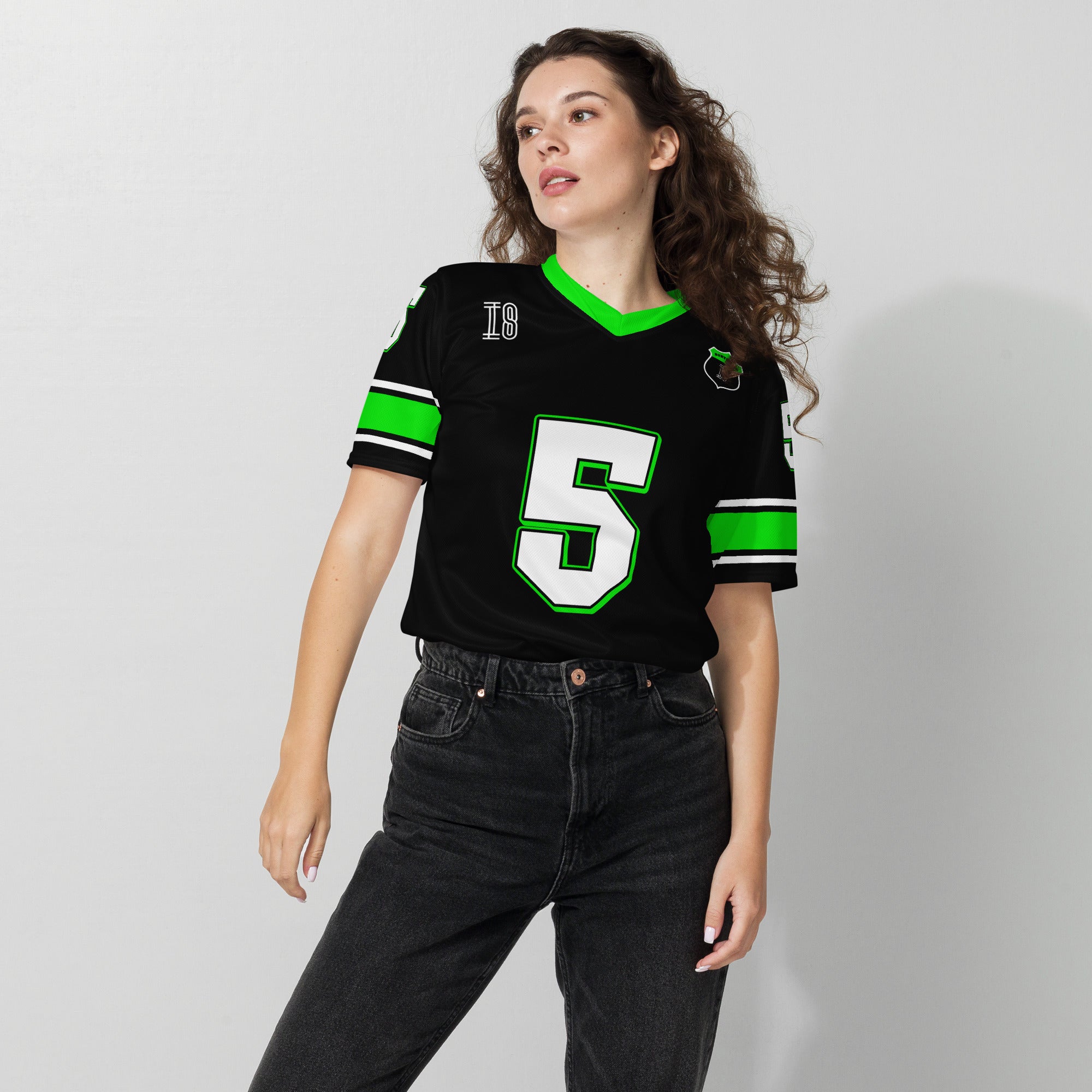 A black and highlight green football jersey with Gabriel Bortoleto's Kick Stake F1 racing number 5 on the front and back in green.
