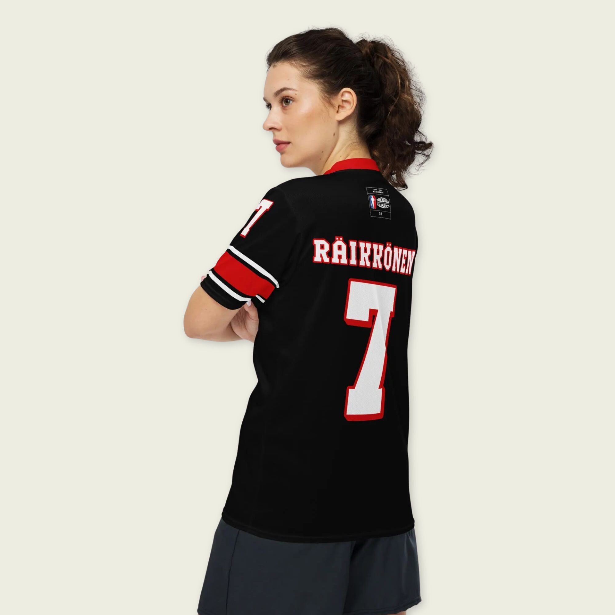 A black and red football jersey with Kimi Raikkonen's Ferrari F1 Racing number 7 on the front and back.