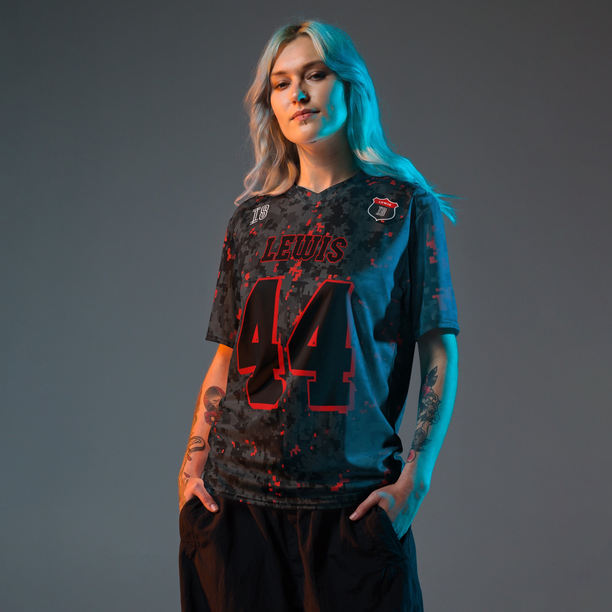 A camoflauge ferrari red and black digital camo styled football jersey with  Lewis Hamilton's Ferrari  F1 Racing number 44 on the front and back.