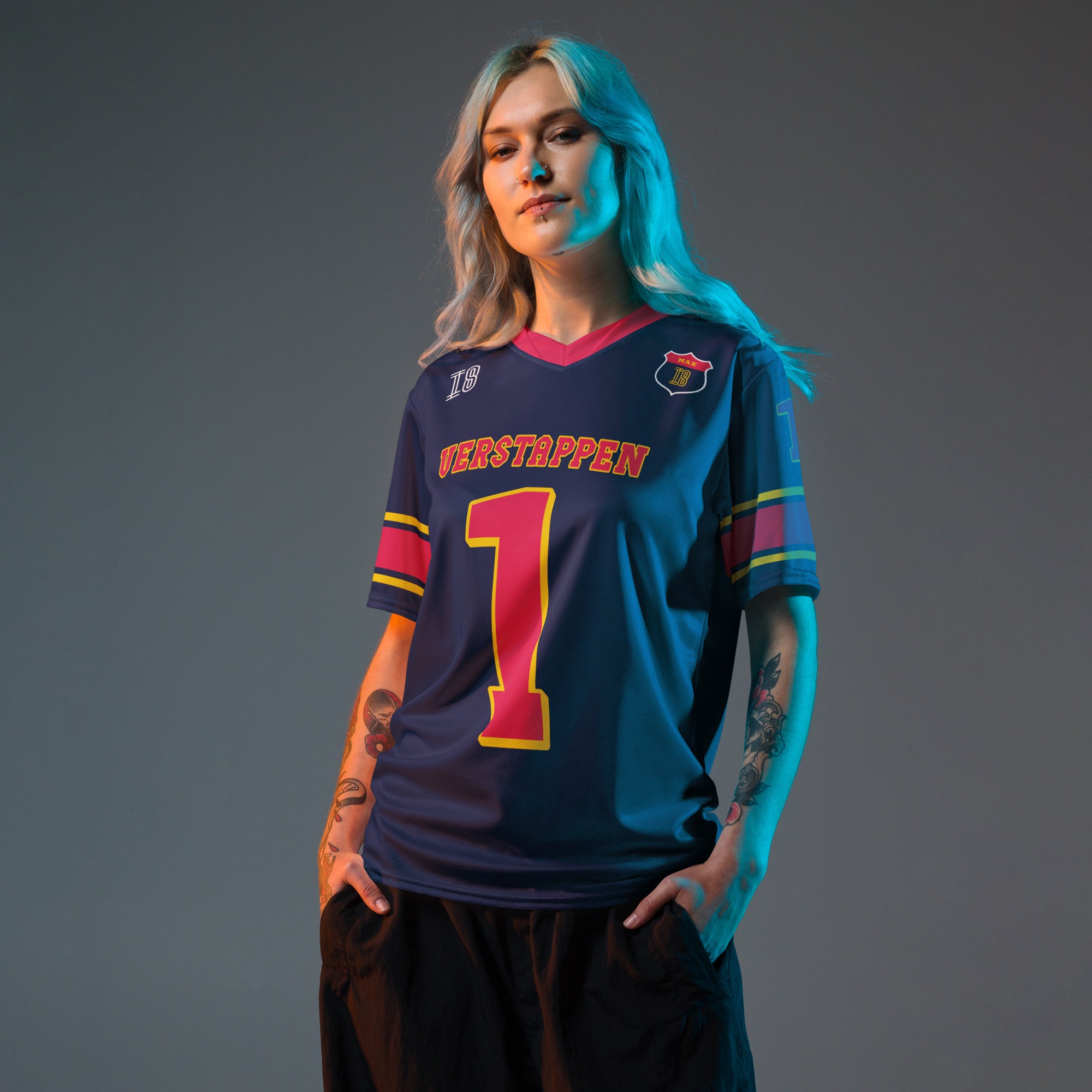 A navy blue and red football jersey with  Max Verstappen's Redbull F1 racing number 1 on the front and back.